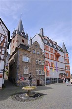 Karlsbad Square with ornamental fountain and church tower of St. Michael in Bernkastel-Kues