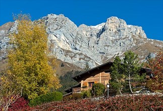Chalet at the foot of the La Tournette mountain range in autumn
