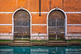 Entrance gate to a residential building on the Grand Canal in the lagoon city of Venice