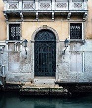 Entrance gate to a residential building on the Grand Canal in the lagoon city of Venice