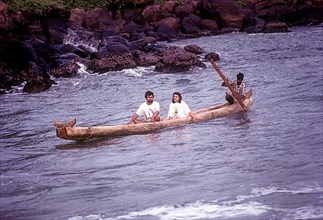 Tourists enjoying ride on Catamaran in Kovalam beach near Thiruvananthapuram