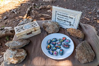 Sale of painted stones with angels at the hiking trail near Las Tricias