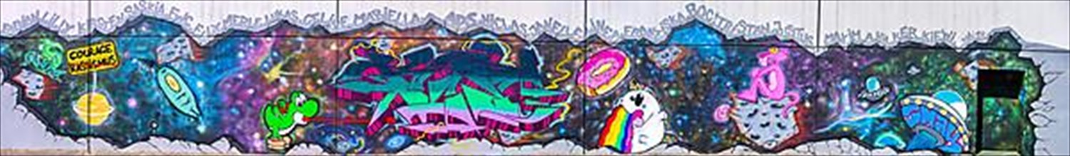 Panorama of graffiti on a house wall promoting more courage