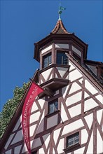End tower of the Pilatus House with flag of the Nuremberg Old Town Friends