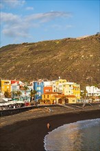 Lava beach and colourful houses in Puerto de Tazacorte