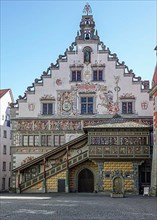 Old town hall in Gothic style with picture friezes and oriel