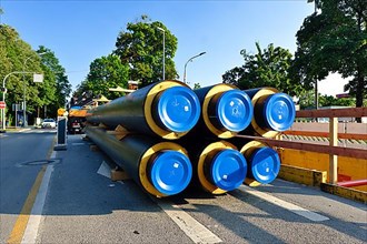 Six insulated district heating pipes in front of installation