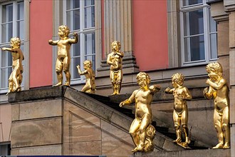 Golden figures on angel's staircase in front of Potsdam City Palace