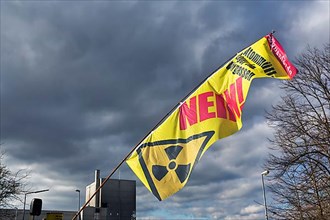 Sunlit banner with signs for radioactivity and the word No