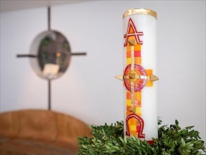 Large candle with alpha and omega signs in Germany's first private ecumenical motorway church 'Geiselwind Licht auf unserem Weg' on the A 3 between Wuerzburg and Nuremberg