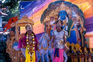 Drama artists in a festival procession dressed like lord Vishnu and Arjunan in Thrissur or Trichur