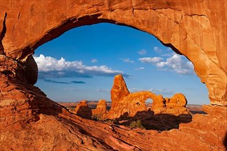View through the North Window rock arch in the morning to the Turret Arch rock formation