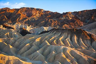 Coloured rock formations in the evening light at Zabriskie Point