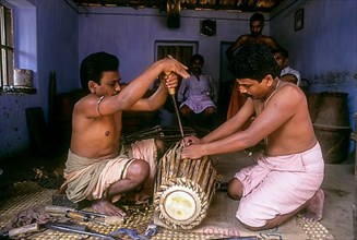 Making of Jendai or leather music instrument in Peruvemba