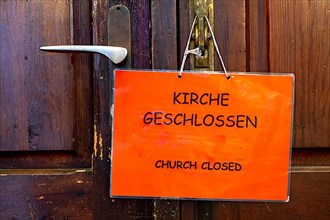 Sign church closed on a door of the Heiliggeistkirche in Heidelberg