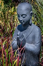 Praying Buddha figure
