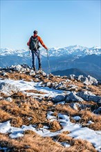 Mountaineer in front of mountain panorama