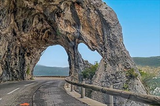 Rock arch on road near Greolieres