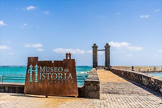 The sign saying History Museum of Arrecife and Bridge of the balls leading to San Gabriel Castle where the museum is located
