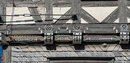 Half-timbered house decorated with carvings in the old town