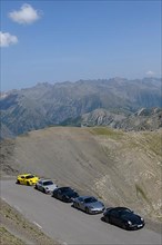 View of five Porsche sports cars on 2802 metre high mountain road
