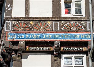 Coloured carving on half-timbered house