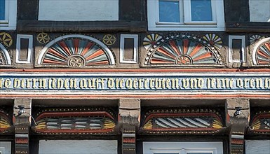 Coloured carving on half-timbered house