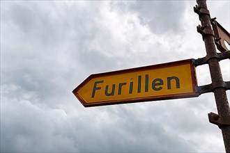 Yellow sign with inscription Furillen