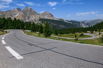 Panoramic view of winding alpine road Mountain road in front of Col de l Izoard