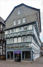 Half-timbered house with slate shingles in the old town