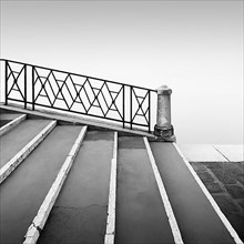 Black and white photograph of a bridge railing in the fog at the Fondamenta Nuove in the north of Venice