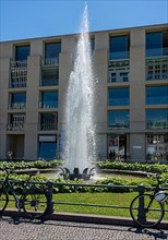Water fountain on Pariser Platz in front of a DZ Bank branch