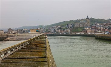 Coastal village of Le Treport at the mouth of the Bresle on the English Channel with Saint-Jacques church
