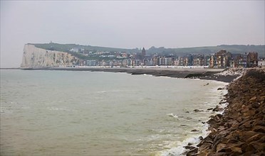 View from the coastal village of Le Treport at the mouth of the Bresle on the English Channel to Mers-les-Bains in the Somme department with the chalk cliff