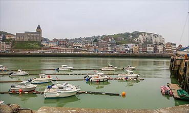 Coastal village of Le Treport at the mouth of the Bresle on the English Channel with Europe's highest chalk cliff and Saint-Jacques church