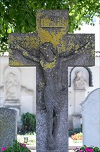 Weathered stone cross with Jesus figure