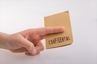 Brown paper text confidental on a white background