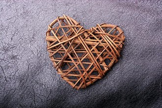 Handmade straw heart or valentines day object in view