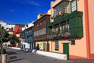 Balconies decorated with flowers on the houses of the Avenida Maritima of the city of Santa Cruz de la Palma
