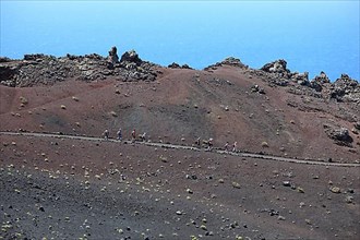 Hikers on the way from San Antonio Volcano to Teneguia Volcano at Cap Fuencaliente