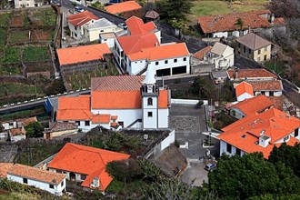 View of the village with church Porto Moniz on the northwest coast of Madeira Island