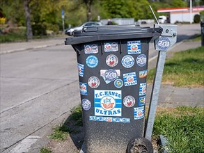 Bin with stickers of football fans and Ultras of FC Hansa Rostock at the motorway service station Hardtwald West