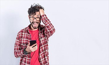 Worried man clutching his head holding cellphone, Worried person with cellphone holding his head on isolated background