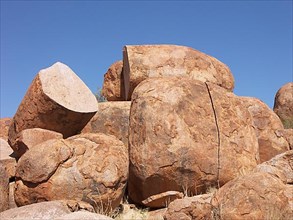 The Devils Marbles lie like giant pebbles in the landscape, Australia -