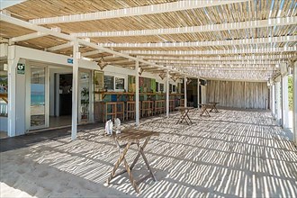 Empty terrace at beach bar Chiringuito Ponderosa Beach, Can Picafort