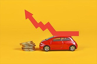 Small car with rising arrow and money coins on yellow background,
