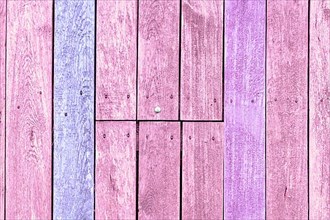 Wooden background with pink and purple painted planks,