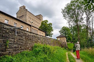Photographer taking pictures of Generaloberst Beck barracks, former Nazi order castle called the Burg