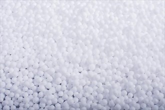 White little polystyrene foam balls as background,