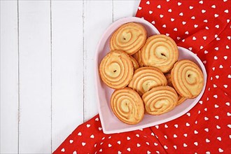 Round ring shaped spritz biscuits called 'Spritzgeback', a type of German butter cookies